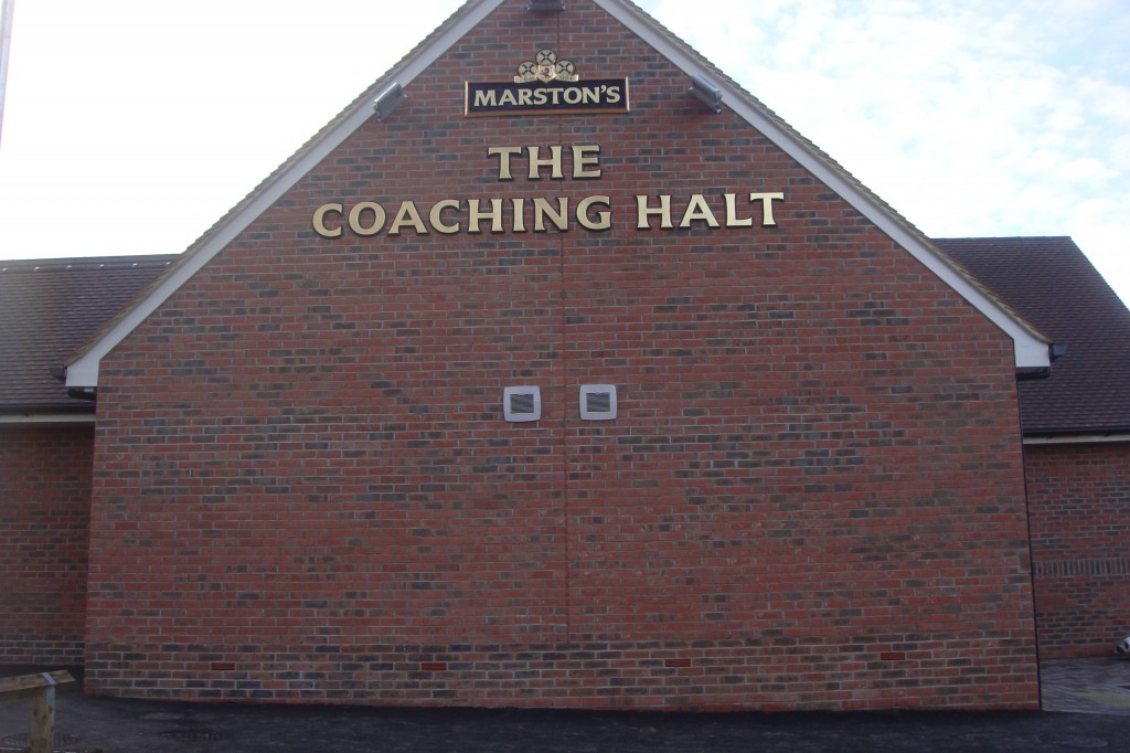 Brick gable of The Coaching Halt, a Marston's pub, built in red facing brick